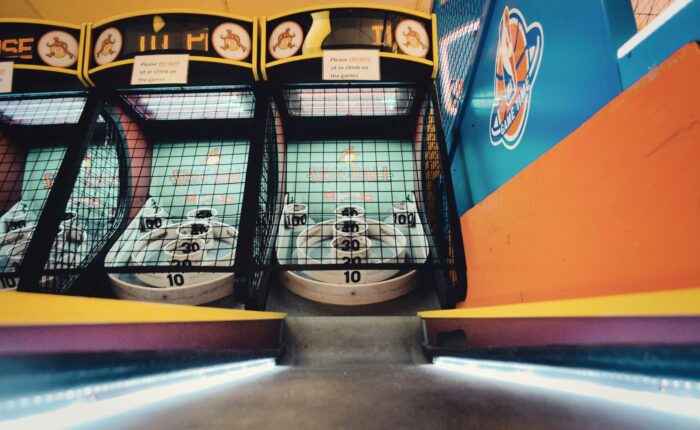 a two arcade machines with a net