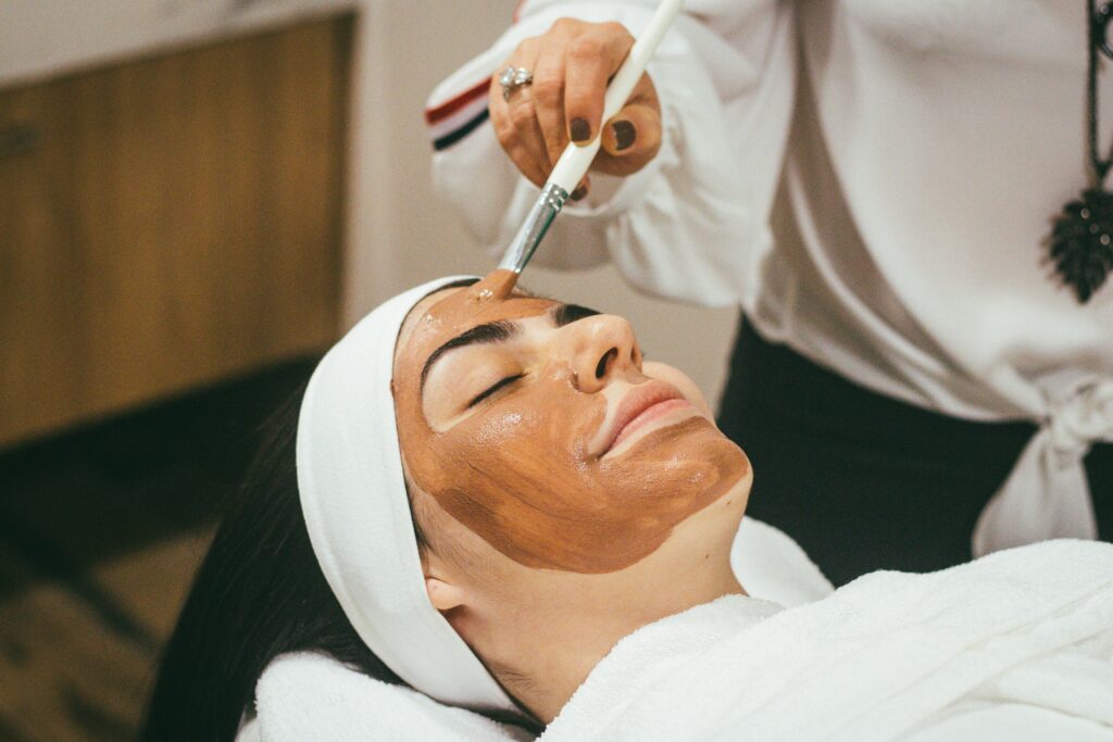 a woman with brown facial mask