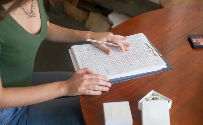 a woman writing on a book